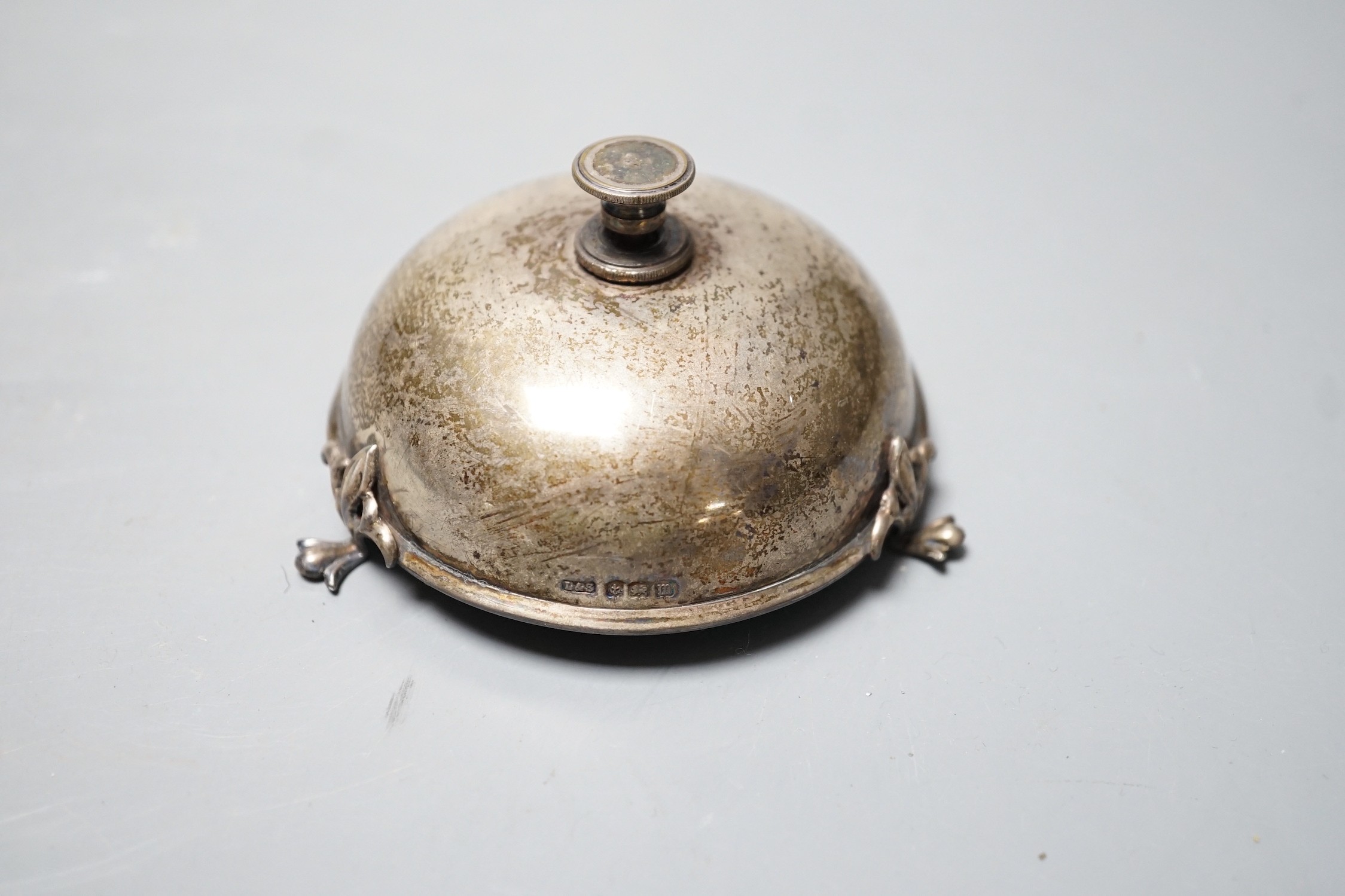 A George V silver mounted table bell, Levi & Salaman, Birmingham, 1911, diameter 86mm.